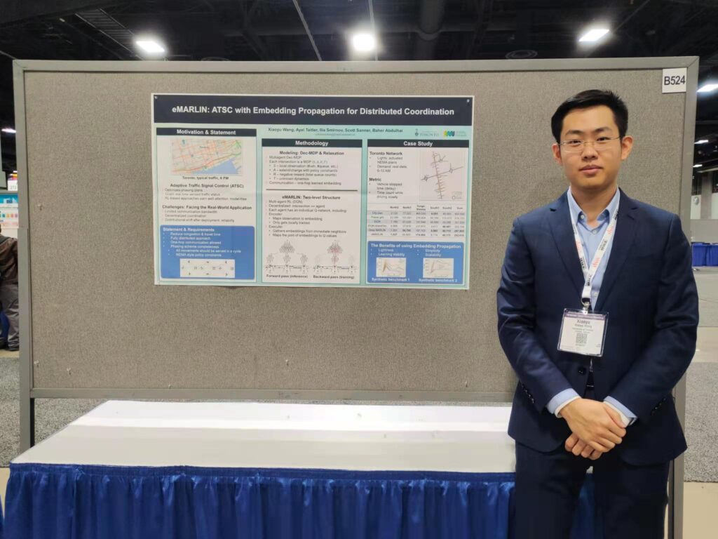 Xiaoyu Wang with his TRB 2023 research poster, Washington, DC.